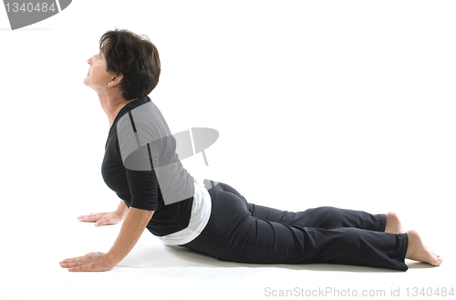 Image of female yoga position cobra elbow press
