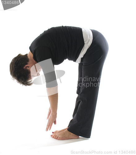 Image of female yoga position toe touch hamstring stretch