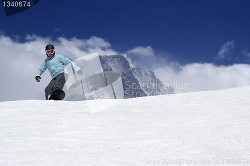 Image of Snowboarding in high mountains