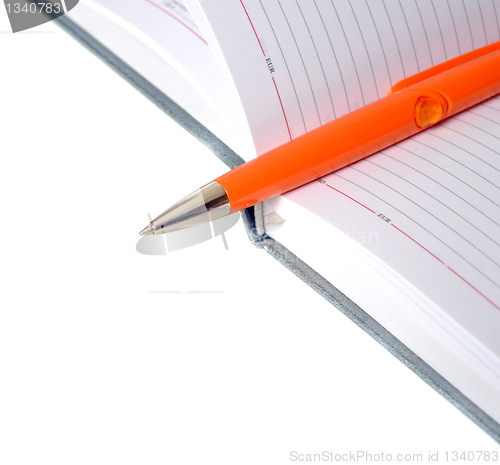 Image of The diary and pen isolated on a white background