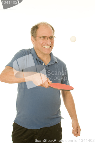 Image of senior man playing ping-pong table tennis