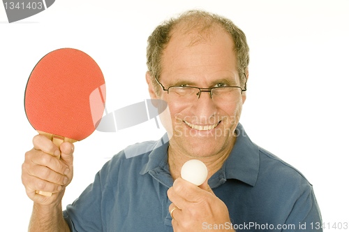 Image of senior man playing ping-pong table tennis