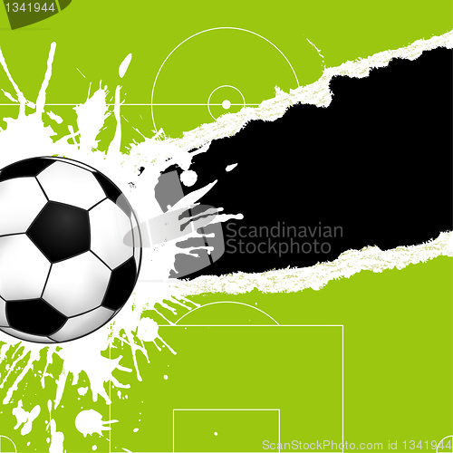 Image of Soccer ball on torn paper