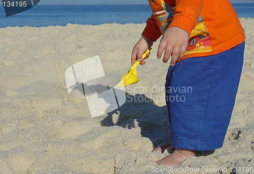 Image of Kid playing on the beach
