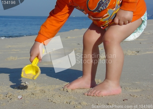 Image of Kid playing on the beach