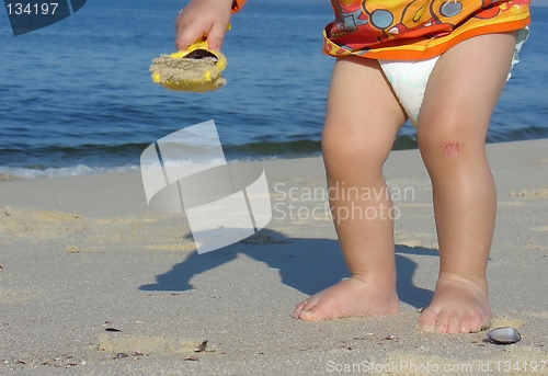 Image of Kid playing on the beach