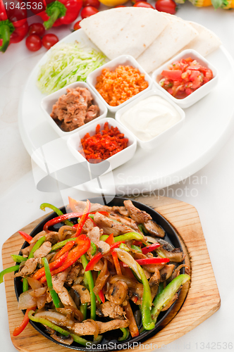 Image of original fajita sizzling hot  on iron plate