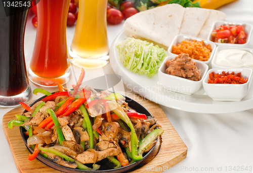 Image of original fajita sizzling hot  on iron plate