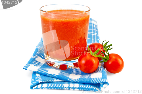 Image of Juice tomato in glass on a napkin