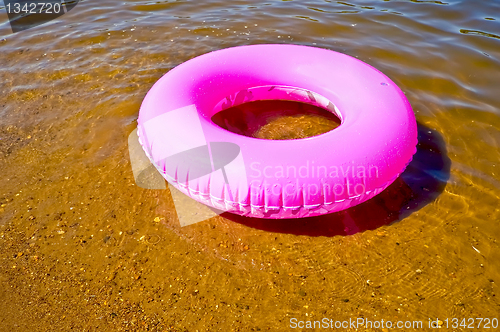 Image of Pink lifebuoy in the water