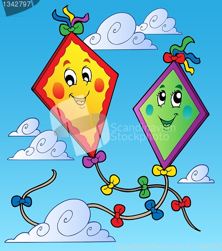 Image of Two flying kites on blue sky