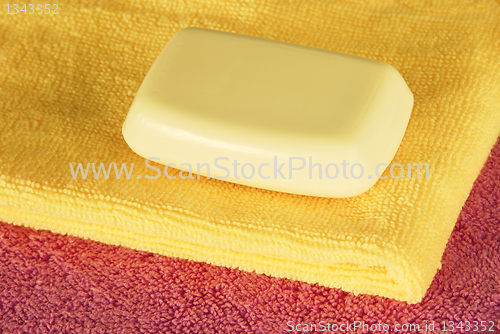Image of Soap bar on colorful towels