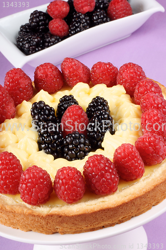 Image of Custard tart with raspberries and blackberries