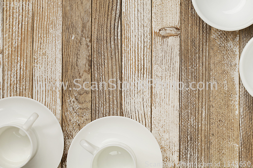 Image of coffee cups on grunge wood
