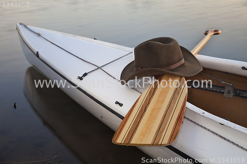 Image of paddle, hat and canoe