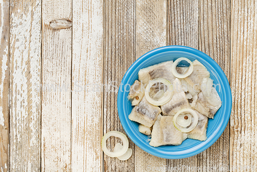 Image of herring in wine with onion
