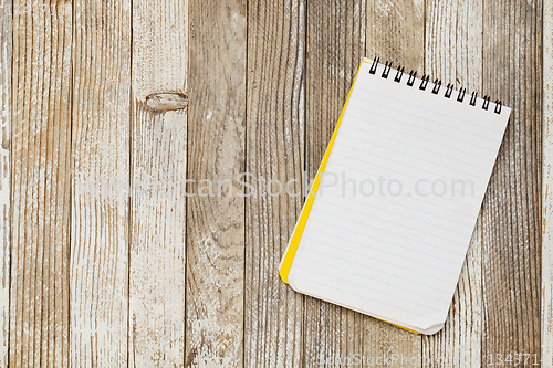 Image of notebook on a rustic table