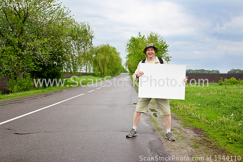 Image of tourist on a country road