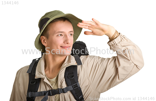 Image of young man dressed in a tourist 