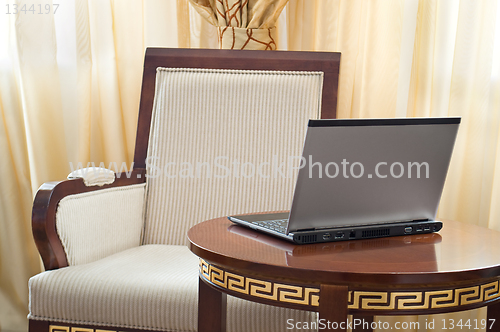 Image of notebook (laptop) on a  home interior