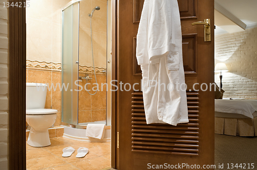 Image of  WC, bathrobe, shower cubicle.