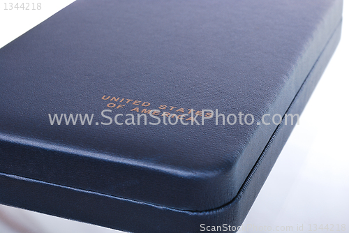 Image of dark blue box with the inscription "United States"