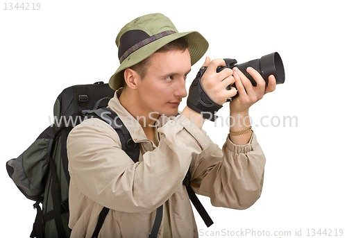 Image of young man dressed in a tourist 