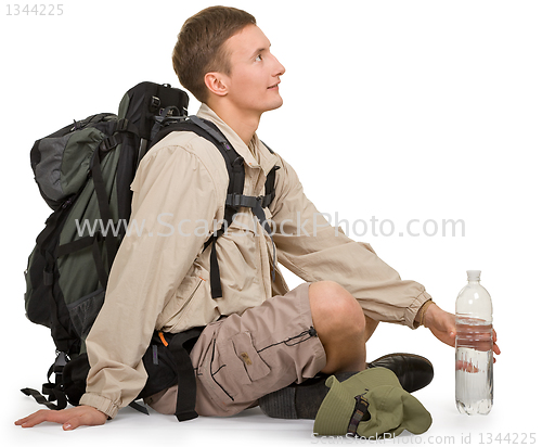 Image of young man dressed in a tourist 