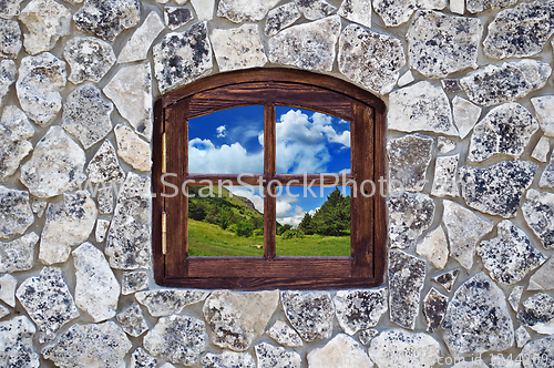 Image of stone wall with a window 