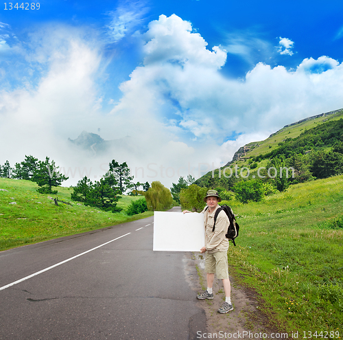 Image of tourist on the mountain path