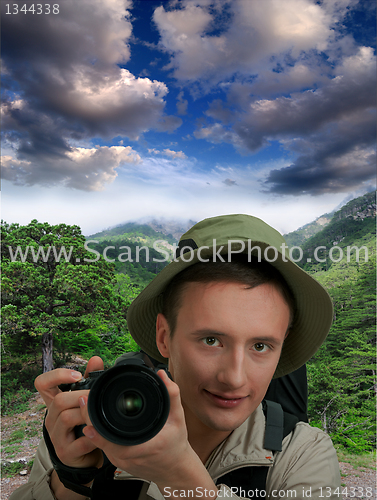 Image of young tourist with camera