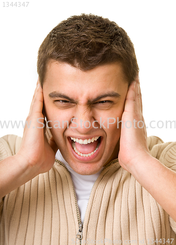 Image of man shuts his ears hands