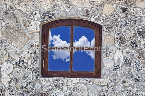 Image of stone wall with a window 