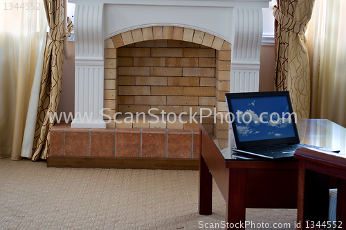 Image of notebook (laptop) on a  home interior