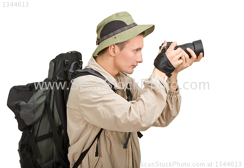 Image of young man dressed in a tourist 