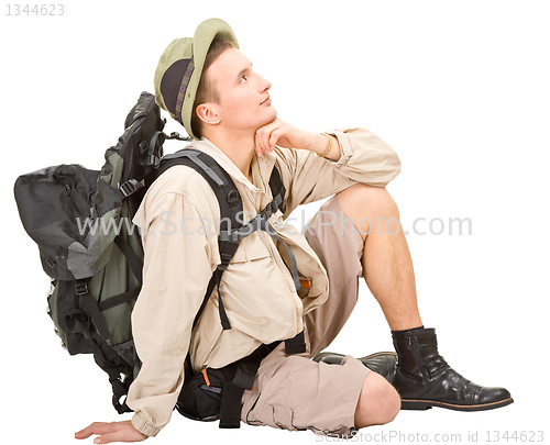 Image of young man dressed in a tourist 