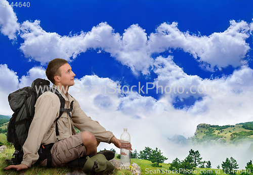 Image of young man dressed in a tourist 