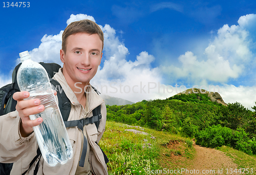 Image of young man dressed in a tourist 