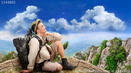 Image of young man dressed in a tourist 