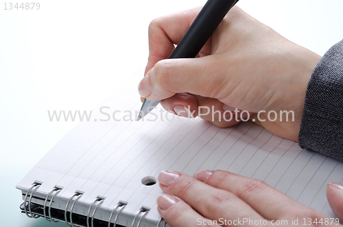 Image of hand with a pen