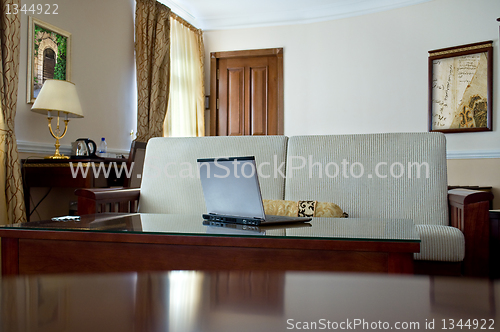 Image of notebook (laptop) on a  home interior