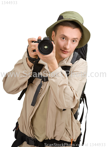 Image of young man dressed in a tourist 