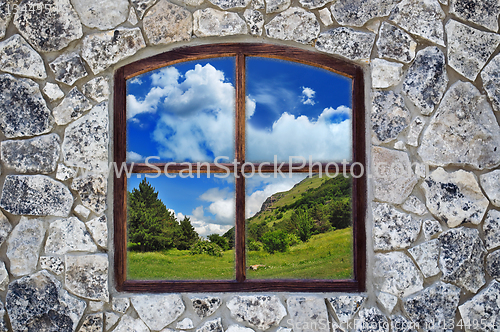 Image of stone wall with a window 