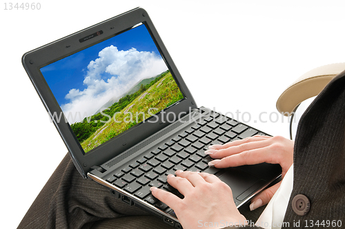 Image of hands on laptop keyboard