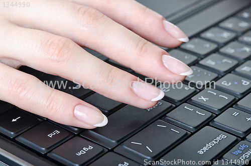 Image of fingers over the keyboard