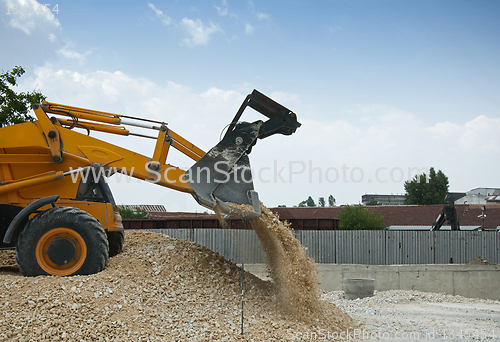 Image of Excavator unload gravel