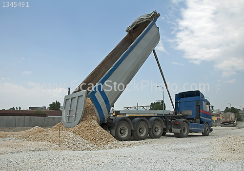 Image of Truck unload rocks