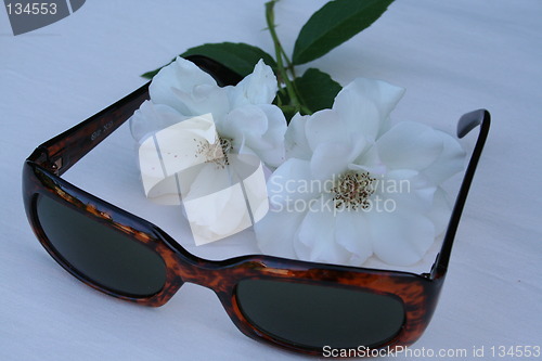 Image of Sunglasses and white roses