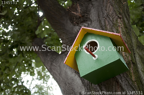 Image of Home-made bright colored bird house 