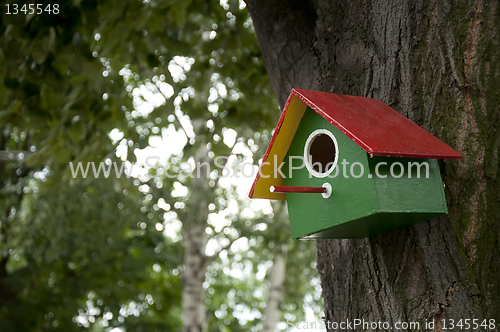 Image of Home-made bright colored bird house 